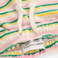 Close-up of a colorful striped fabric with a Bobo Choses label.