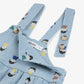 Light blue denim dungarees with character print and straps on a white background