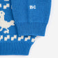 Blue knitted sweater with white pattern on a white background