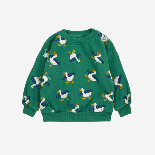 Green sweater with duck pattern on a white background