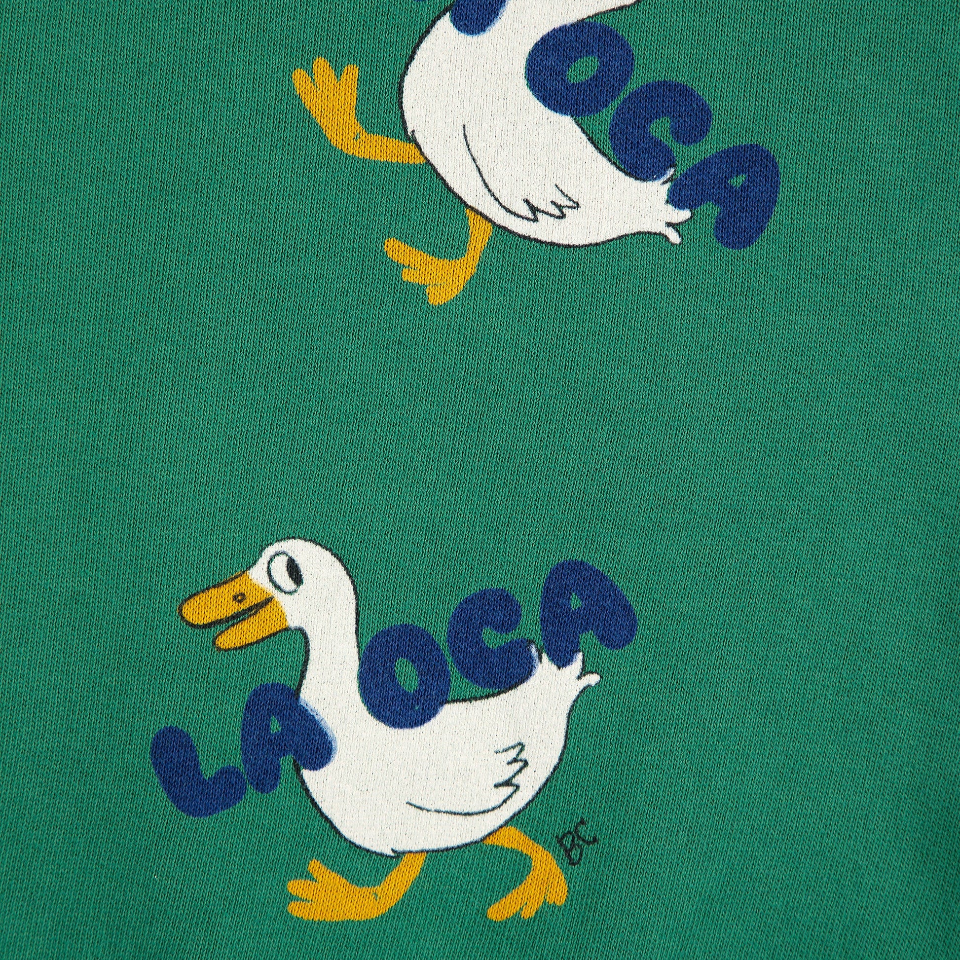 Green fabric with 'La Oca' duck illustrations