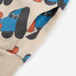 Close-up of a fabric with cartoon dog pattern on a beige background