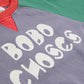 Close-up of a gray sweatshirt with 'BOBO CHOSES' text, red and green sleeves on a white background.