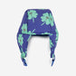 Purple headband with green clover patterns on a white background