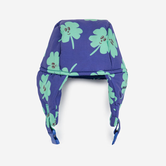 Purple headband with green clover patterns on a white background