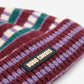 Colorful knitted headband with a brand label on a white background