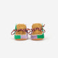 Pair of woven baby shoes with colorful patterns on a white background