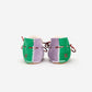 Pair of green and purple woven shoes on a white background