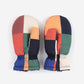 Pair of colorful mittens with a geometric pattern on a white background