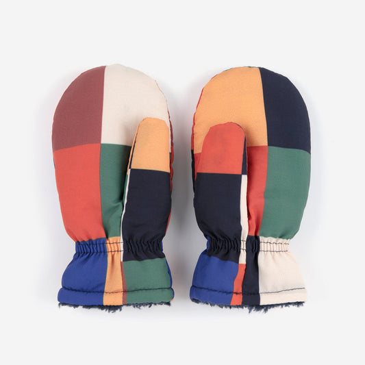 Pair of colorful mittens with a geometric pattern on a white background