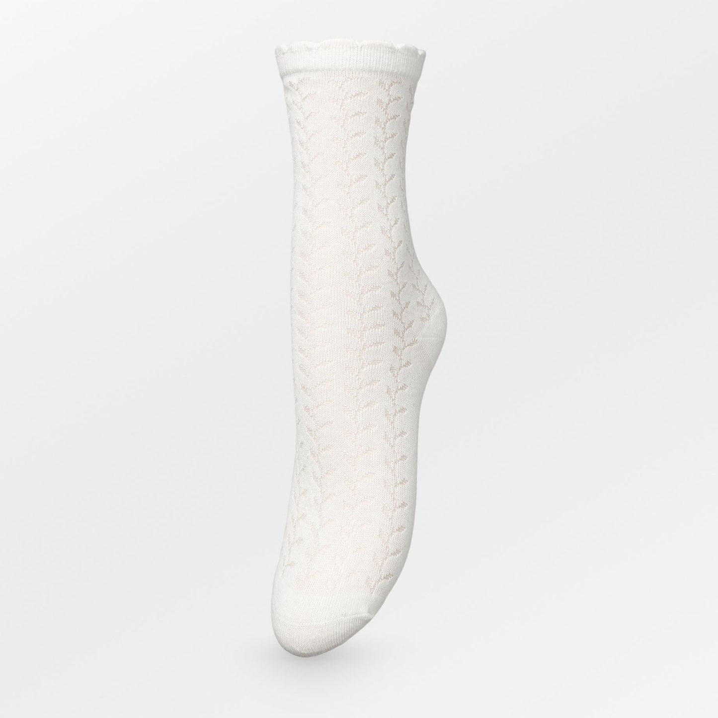 Becksöndergaard Leofa Cotta socks in Birch White, showcasing delicate transparent details, a charming wavy edge, and a subtle glittery finish, displayed against a neutral backdrop.