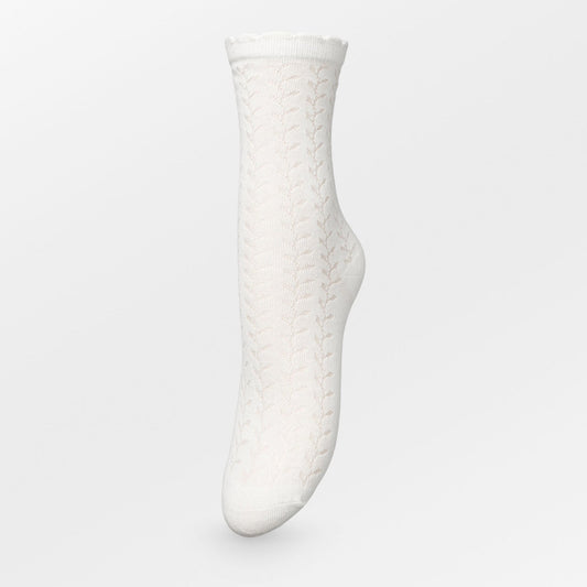 Becksöndergaard Leofa Cotta socks in Birch White, showcasing delicate transparent details, a charming wavy edge, and a subtle glittery finish, displayed against a neutral backdrop.