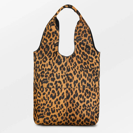 Becksöndergaard Leopa Leather Demi Bag in full view, featuring a striking leopard print, soft leather structure, and cut-out handle design for easy carrying.