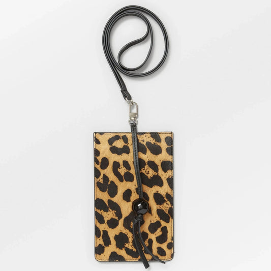 Becksöndergaard Leopa Leather Phone Bag featuring a bold leopard print on 100% cow leather with natural fur, a sleek black strap, and a decorative knot detail with a glossy bead.