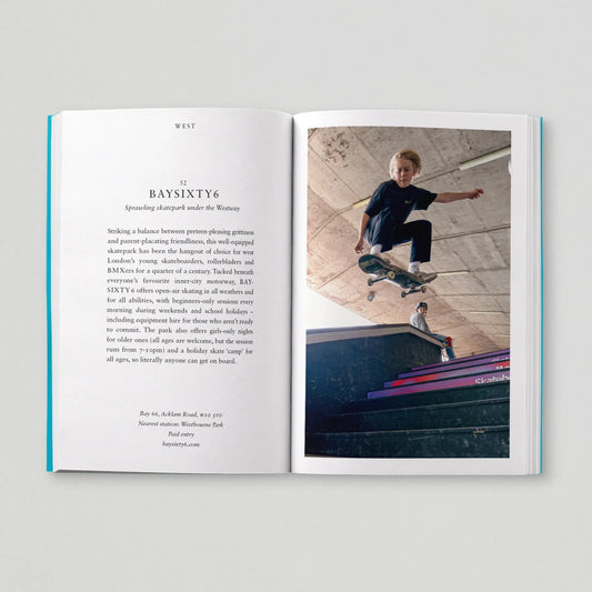 Open book with text and a photo of a person skateboarding on a gray background