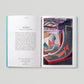 Open book with interior pages on a gray background