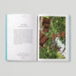 Open book showing a page with text and an image of a person on a Go Ape adventure course.