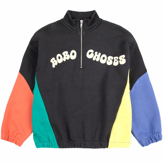 Bobo Choses SS25 Wavy Zipped Sweatshirt featuring a black base with bold, multicoloured panels in orange, green, yellow, and blue. The sweatshirt has a half-zip closure, elasticated cuffs, and 'BOBO CHOSES' in playful, bubble-style typography across the chest.