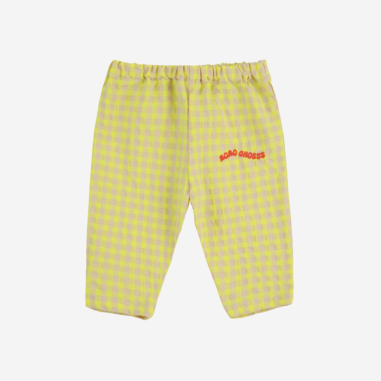 A pair of baby pants with a yellow and beige gingham pattern, featuring an elasticated waistband and the "BOBO CHOSES" logo embroidered in red on the left leg.