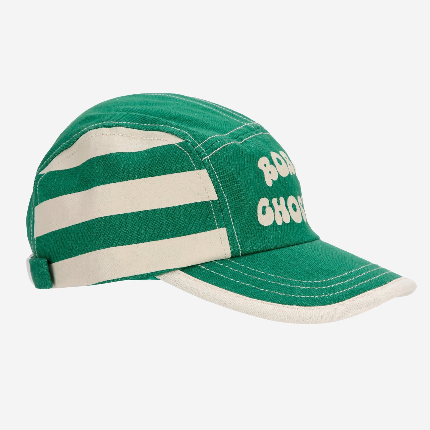 A green Bobo Choses cap with cream horizontal stripes on the sides and "BOBO CHOSES" printed in bold, cream lettering on the front. The cap has white contrast stitching and a curved visor with a cream edge.