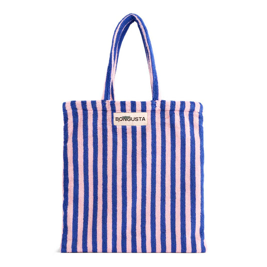 A baby pink and deep blue striped classic tote bag, made of towelling fabric with a baby pink and deep blue striped handle. At the top of the bag it says BONGUSTA in black inside of a cream box with green and lilac flowers coming off the words bongusta. 