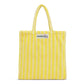 A cream and neon yellow striped classic tote bag, made of towelling fabric with a cream and neon yellow striped handle. At the top of the bag it says BONGUSTA in black inside of a cream box with green and lilac flowers coming off the words bongusta. 