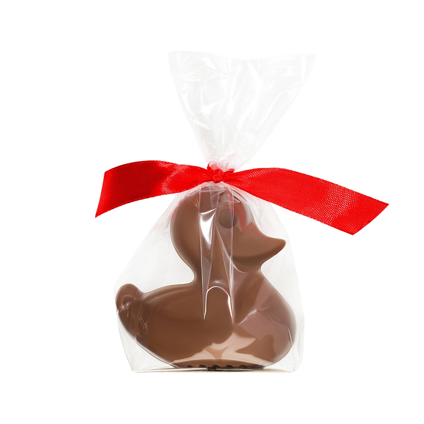 A cute duckling made of milk chocolate is in a cellophane bag tied with a red ribbon