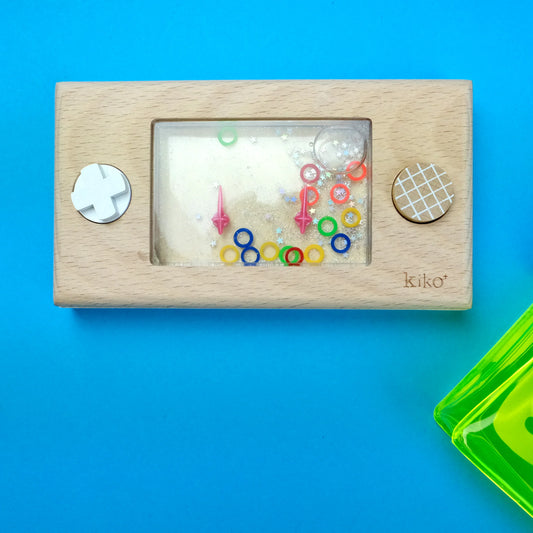 Wooden toy with colourful beads and buttons on a blue background