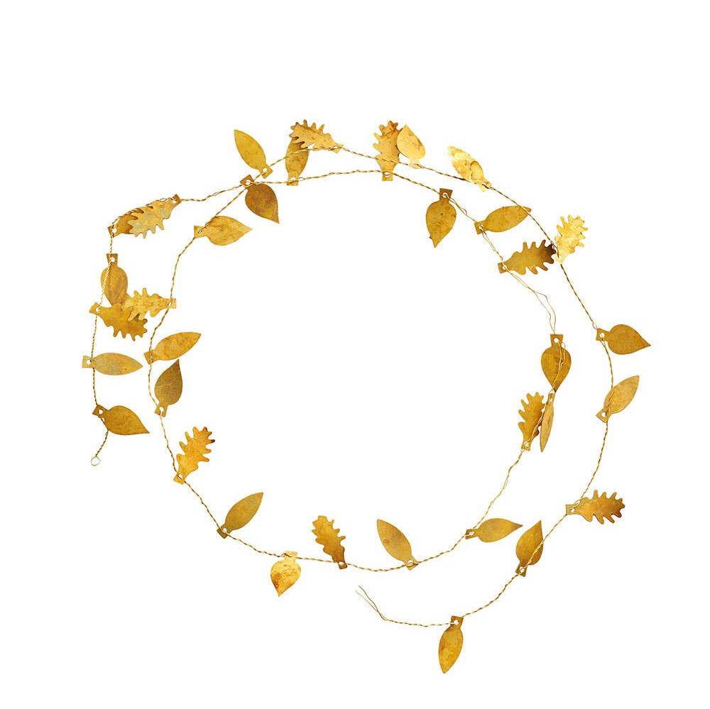 a delicate shiny brass garland with different leaves scattered across the fine wire cord. displayed wrapped double around in a circle