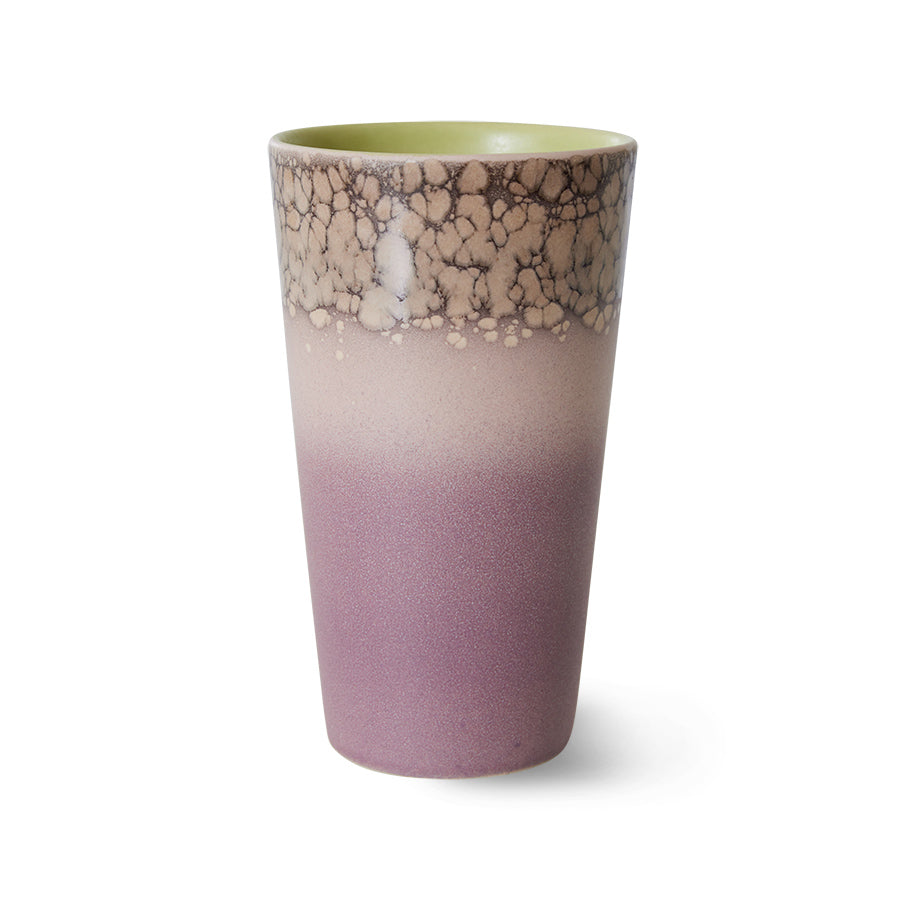 A Hk living haze latte mug, the colours are faded together in chunky stripes from a lilac to a lighter purple then into a cream spotted top section on top of a darker brown. The inside of the mug is lime green.