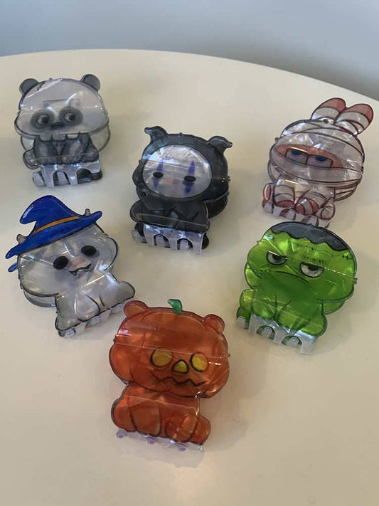 A selection of acrylic hair clips in various shapes for Halloween, for example a pumpkin bear, witch cat, and Mummy rabbit