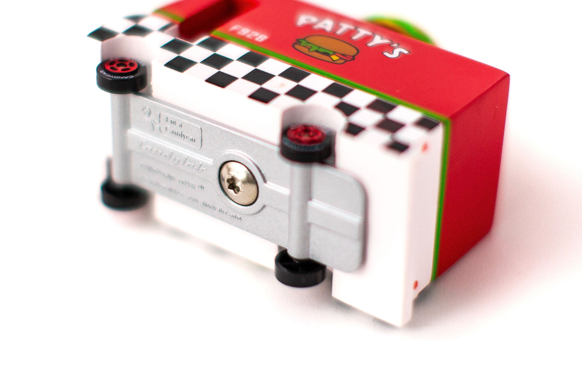 Small mechanical device with a checkered pattern on a white background