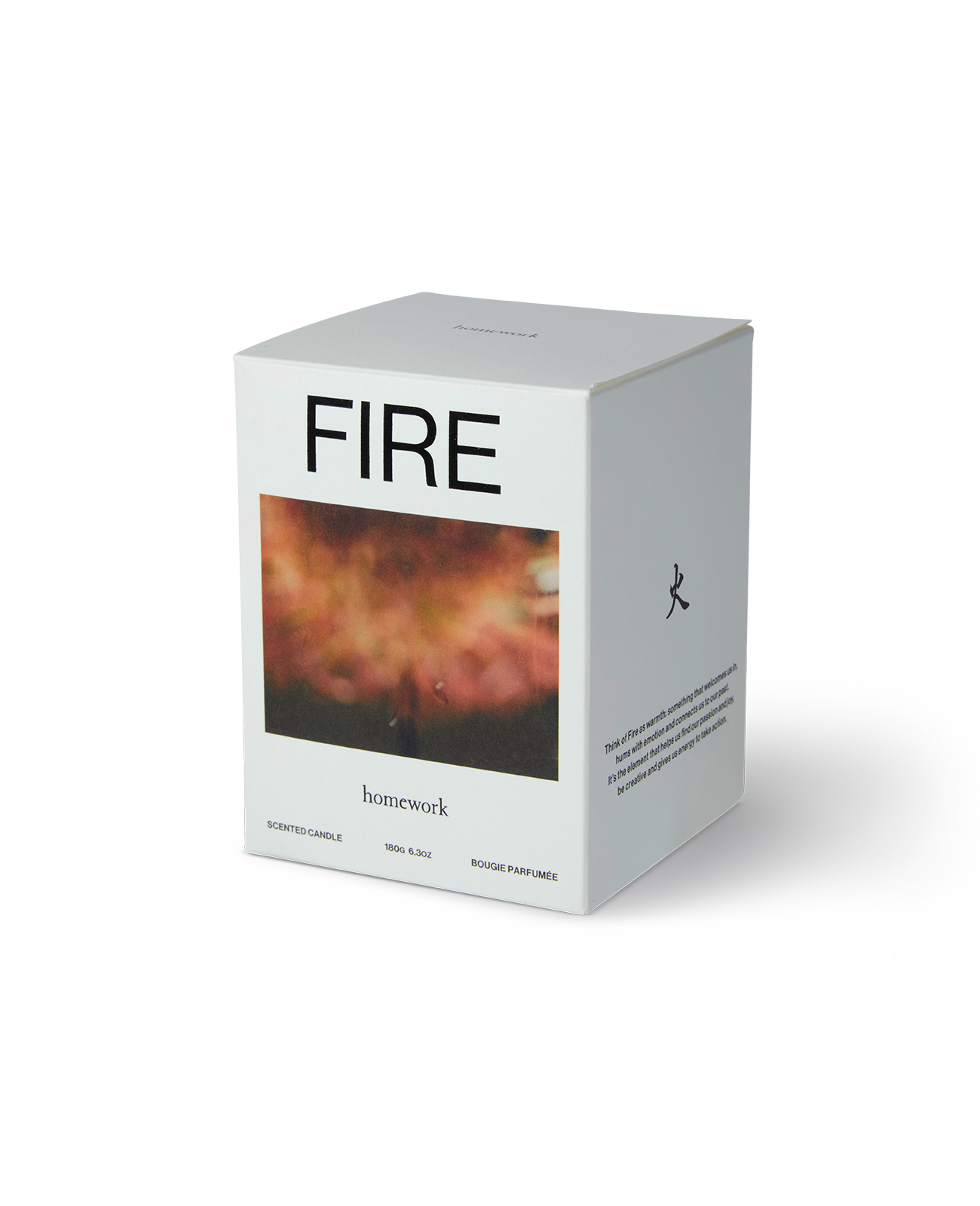 The homework candle packaging in fire, a white box with fire spelt across the top and under this a landscape image of a blurred fire in red tones. Then the brands name homework written under the images in lowercase