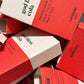 Red and white boxes with 'versatule' branding on a white background