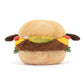 A plush toy in the shape of a cheeseburger. The beige bun has two short brown arm coming out of it. Between the beige buns are the layers of a burger, that being red tomato, yellow cheese, a brown patty and green lettuce. This is against a white background. 