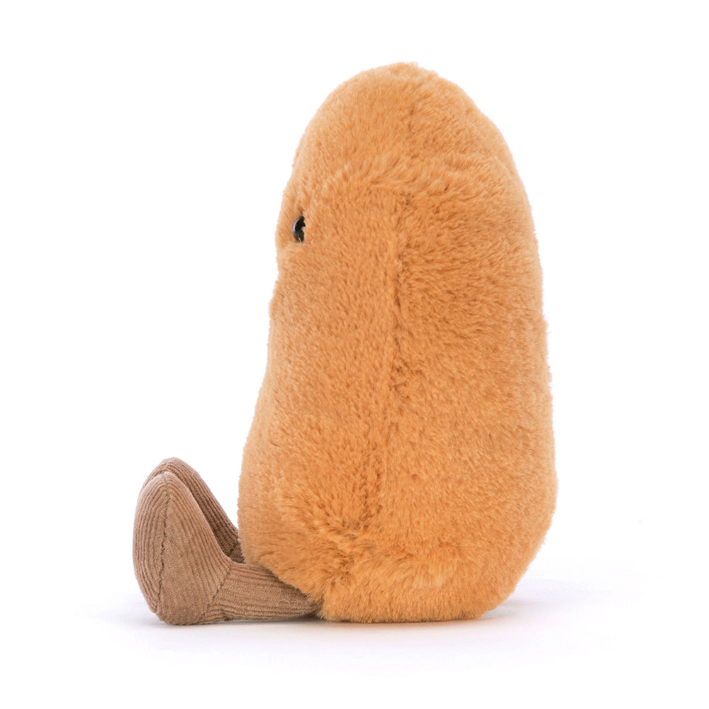 Jellycat Amuseables Bean plush with a soft gingery shell, goofy grin, and a cuddly, bean-shaped body, sitting upright and ready to bring smiles. Shown from the side