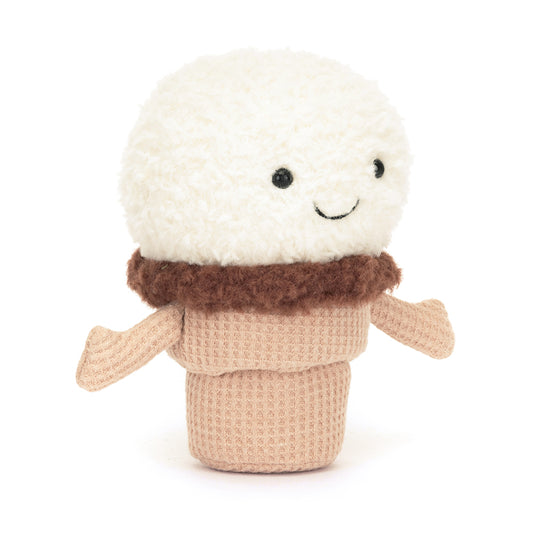 A soft, plush ice cream cone featuring a smiling scoop of ice cream on top and a textured cone base. The ice cream scoop is colorful and whimsical, part of the Jellycat Amusables collection, designed for cuddling and play. The overall design is charming and inviting, perfect for children and plush toy collectors. Shown from the side angle