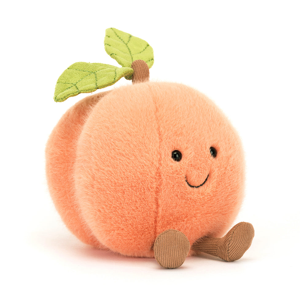 Jellycat Amuseables Peach plush toy with soft halo fur, a smiling face, side dimple, corduroy boots, stitched leaf, and corded stalk, adding a touch of playful charm.