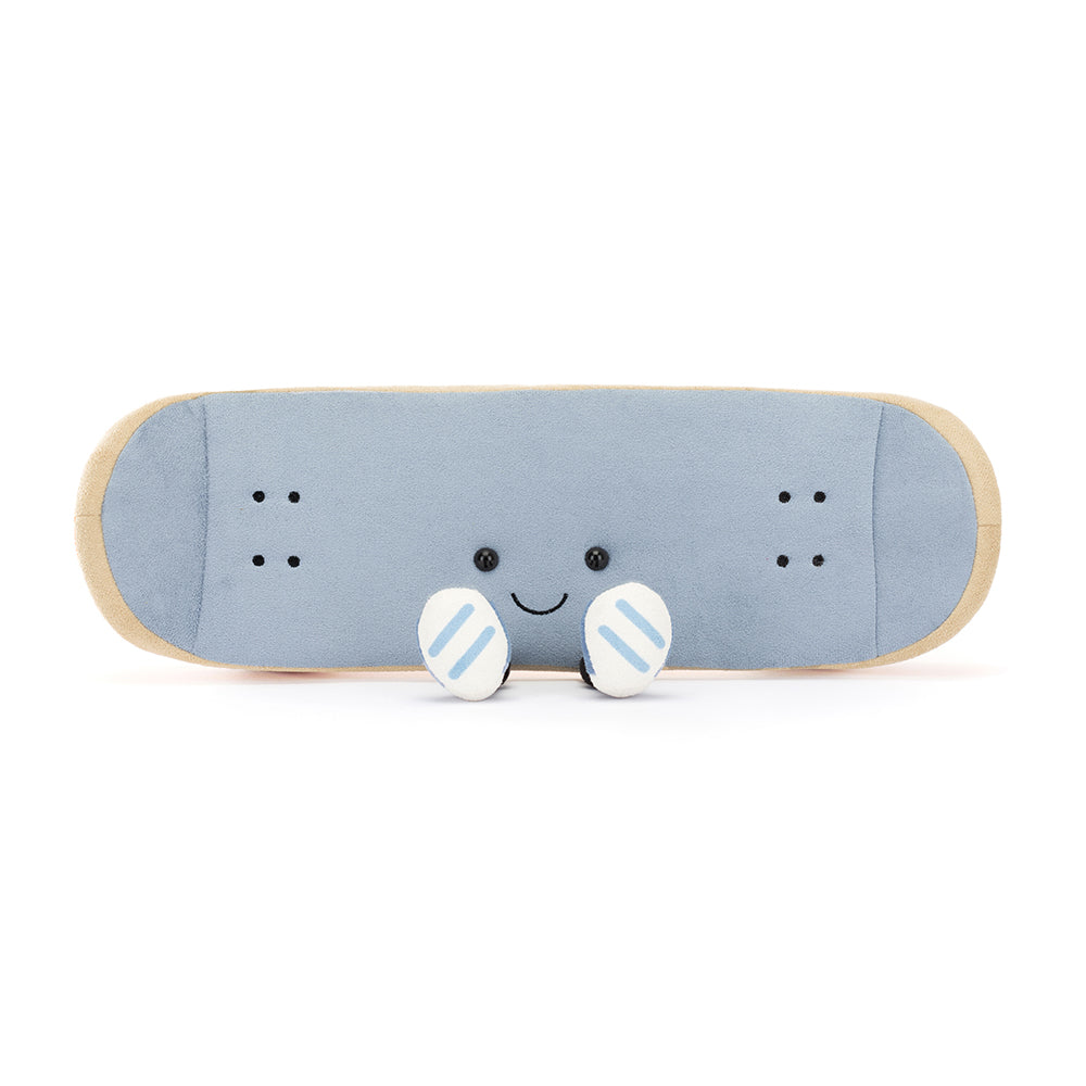 Jellycat Amuseables Sports Skateboarding plush toy in the shape of a skateboard, featuring blue suedette material, beige edging, and orange detailing, resting on soft charcoal wheels.