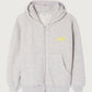 American Vintage Kids Grey Kodytown Hoodie featuring a zip-up front, front pouch pockets, a hood, and a minimalist yellow logo detail on the chest, made from soft cotton fabric.