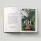 Open book with text on one page and a photograph of two children in a garden on the other, on a light gray background.