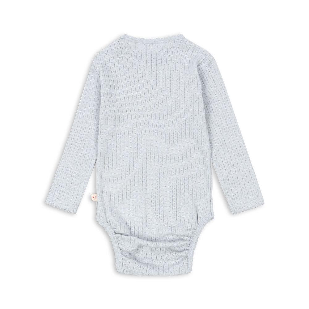 A back view of the Konges Sløjd Minnie Body in gray dawn, showcasing the soft organic cotton fabric and intricate pointelle knit design.