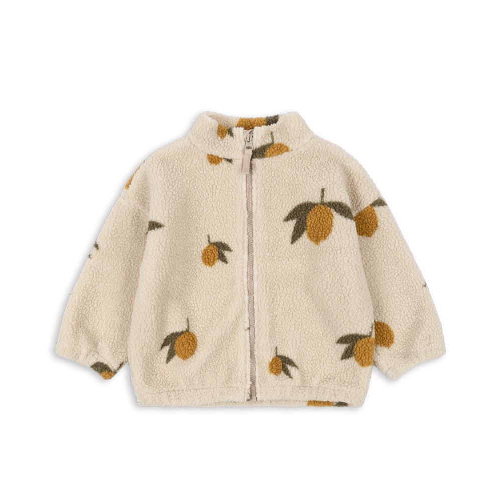 Front view of the Konges Sløjd Mon Grand Citron Jody Jacket – A cosy, cream-coloured fleece jacket with a zip-up front and an all-over lemon print featuring golden yellow fruit and green leaves.