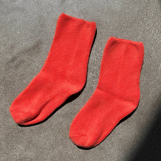 a pair of pinky orange cactus flower thick ankle socks