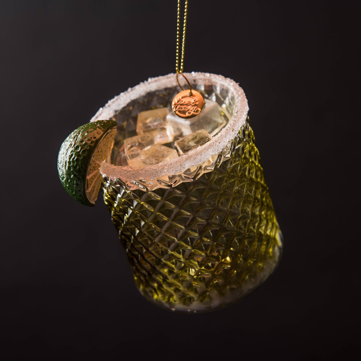 Hand-blown glass Margarita ornament featuring frosty ice, a salted rim, and a hand-painted lime wedge garnish, measuring 3.5" x 3". 