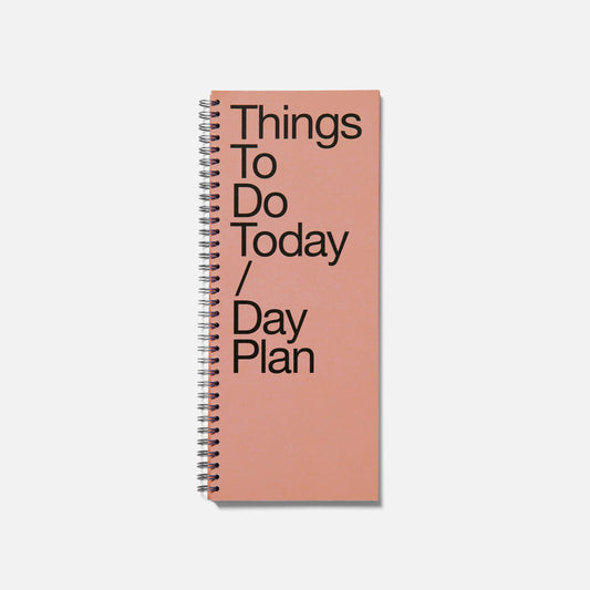 Pink notebook with 'Things To Do Today / Day Plan' text on a white background