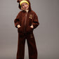 Child wearing a brown bear-themed outfit on a gray background
