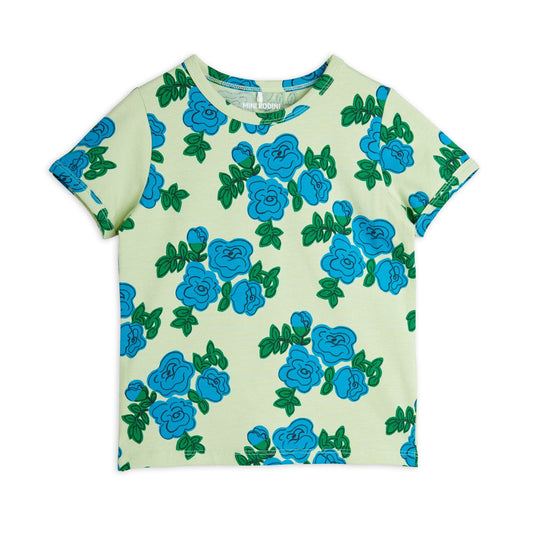 Mini Rodini short-sleeve T-shirt with an all-over blue floral print on a pale green background.