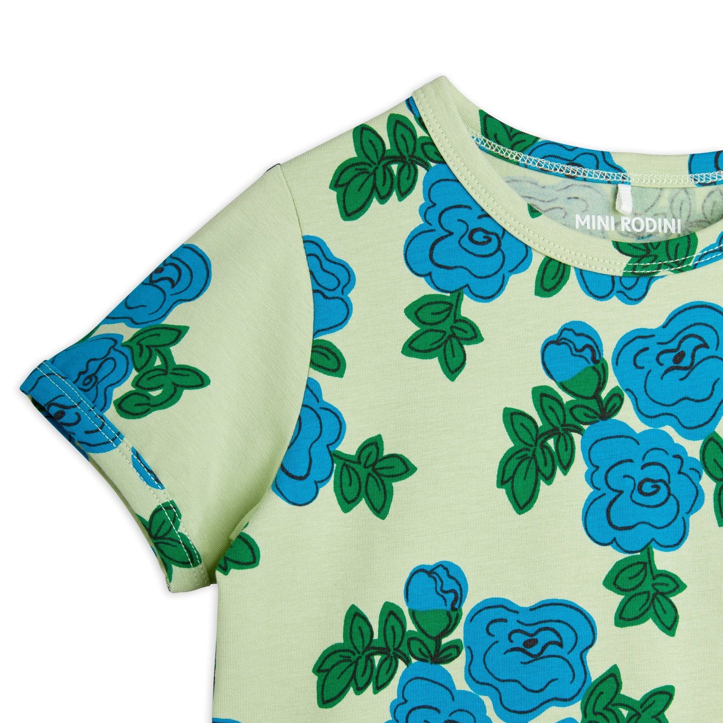 Mini Rodini T-shirt fabric detail, highlighting the high-quality stitching and playful floral pattern.
