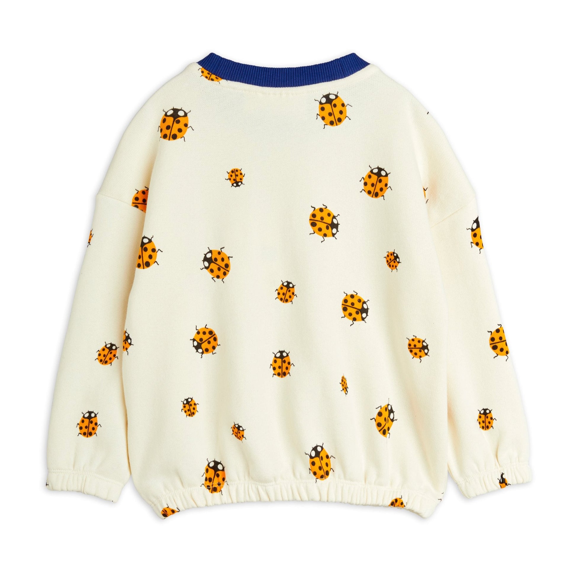 The back of the playful ladybird-print sweatshirt, showcasing its oversized fit and elasticated hem for extra comfort.